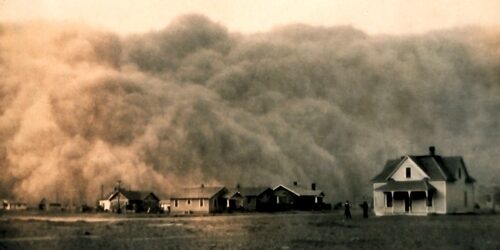Dust clouds dwarfing farm house and people 1935